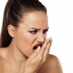 An unpleasant accompanying symptom may be bad breath